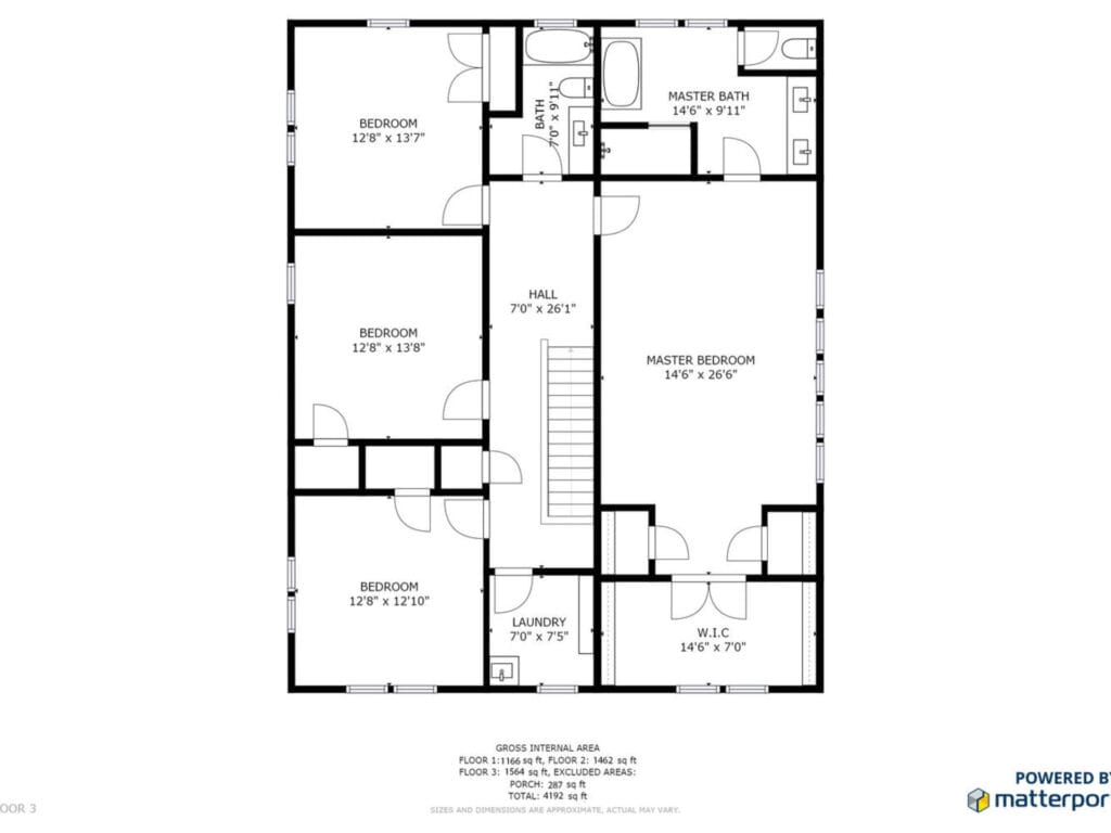Floor plan of a house showcasing a master bedroom with walk-in closet and master bath, two additional bedrooms, another bathroom, a hallway, and a laundry room.